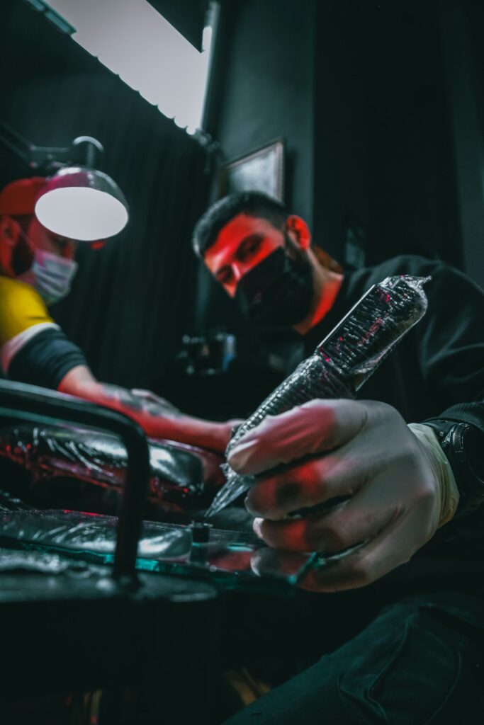 Tattoo artist holding a tattoo machine