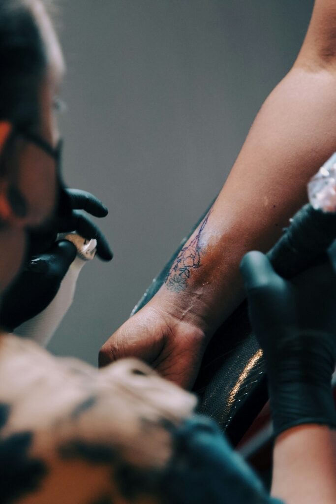 Close up of a tattoo session on the forearm