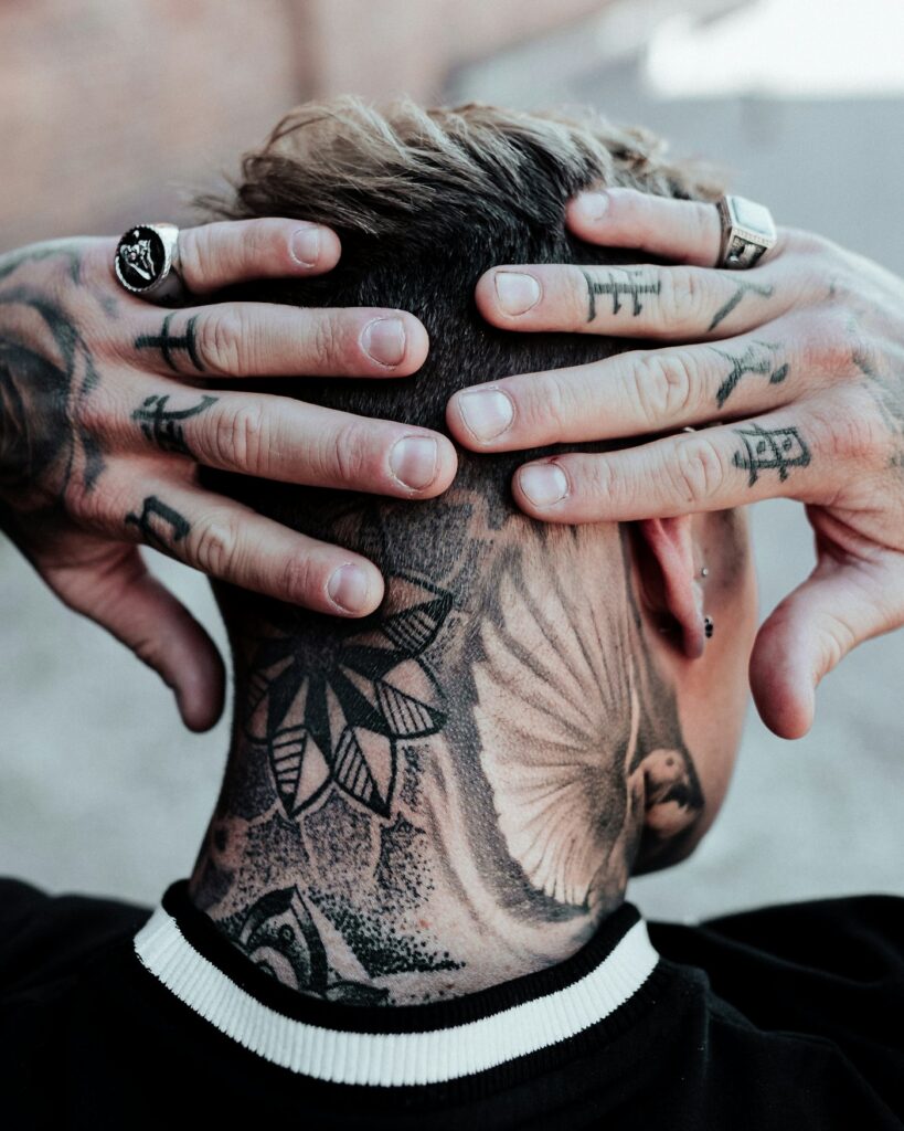 Man with hand tattoos on both hands