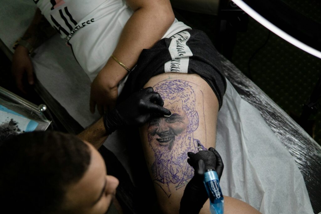 Large thigh tattoo stencil during a tattoo session