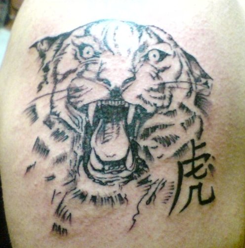 Black ink roaring tiger tattoo with the Chinese character for tiger