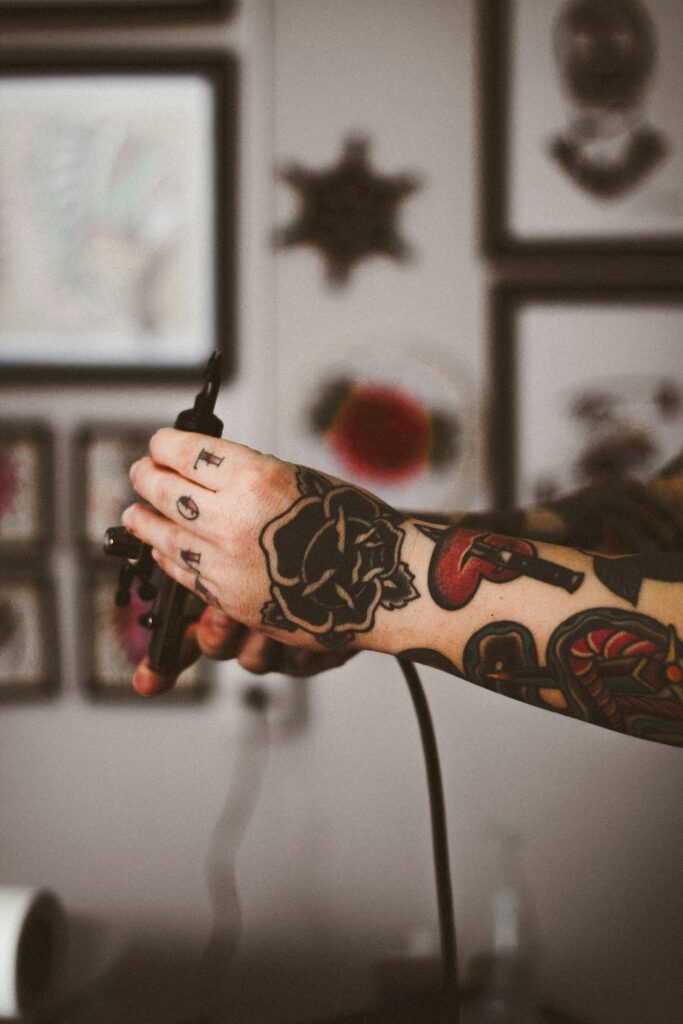 Color traditional flower tattoo on the hand and arm