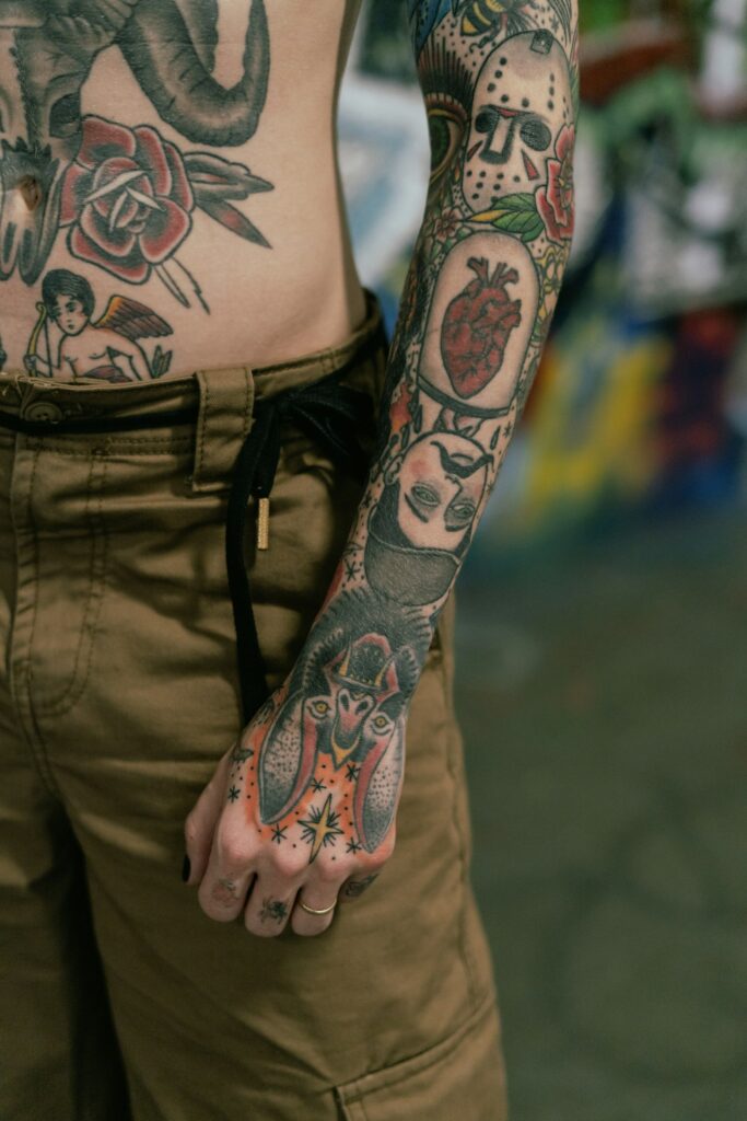 Traditional patchwork tattoos covering a man's arm