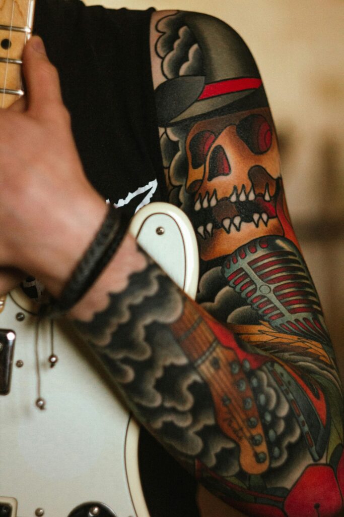 Arm tattoos for men: American traditional skull sleeve