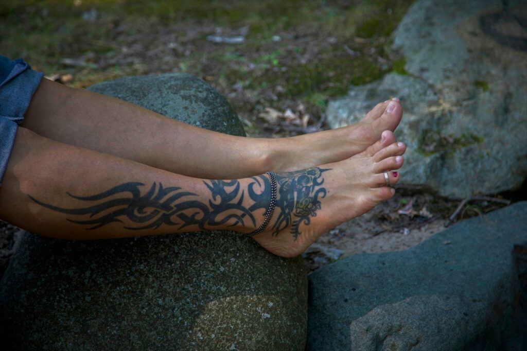 Black tribal tattoo on the lower leg and ankle