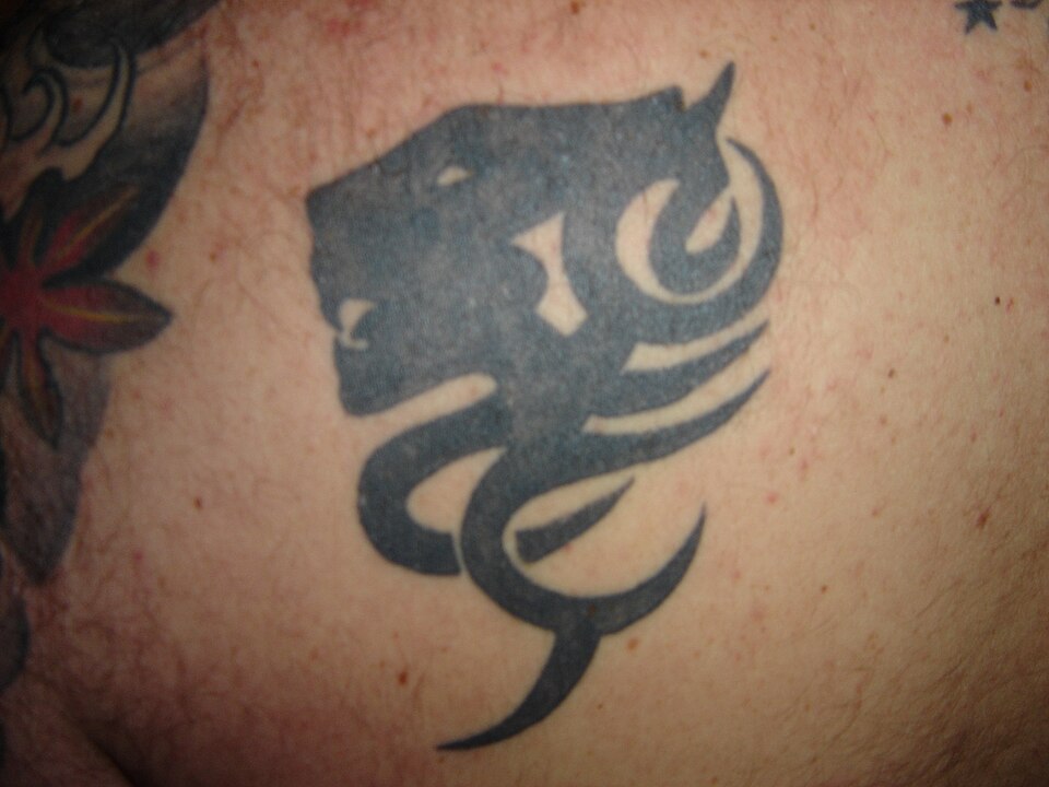 Lion tattoo: black tribal lion head