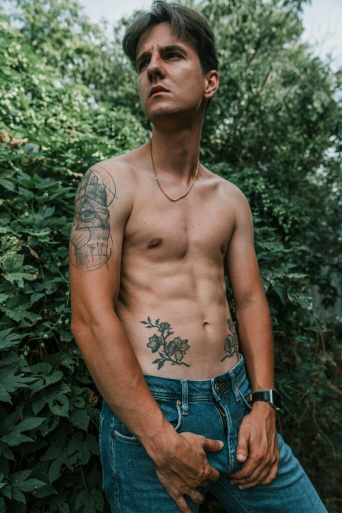Upper arm half sleeve on a man in a garden