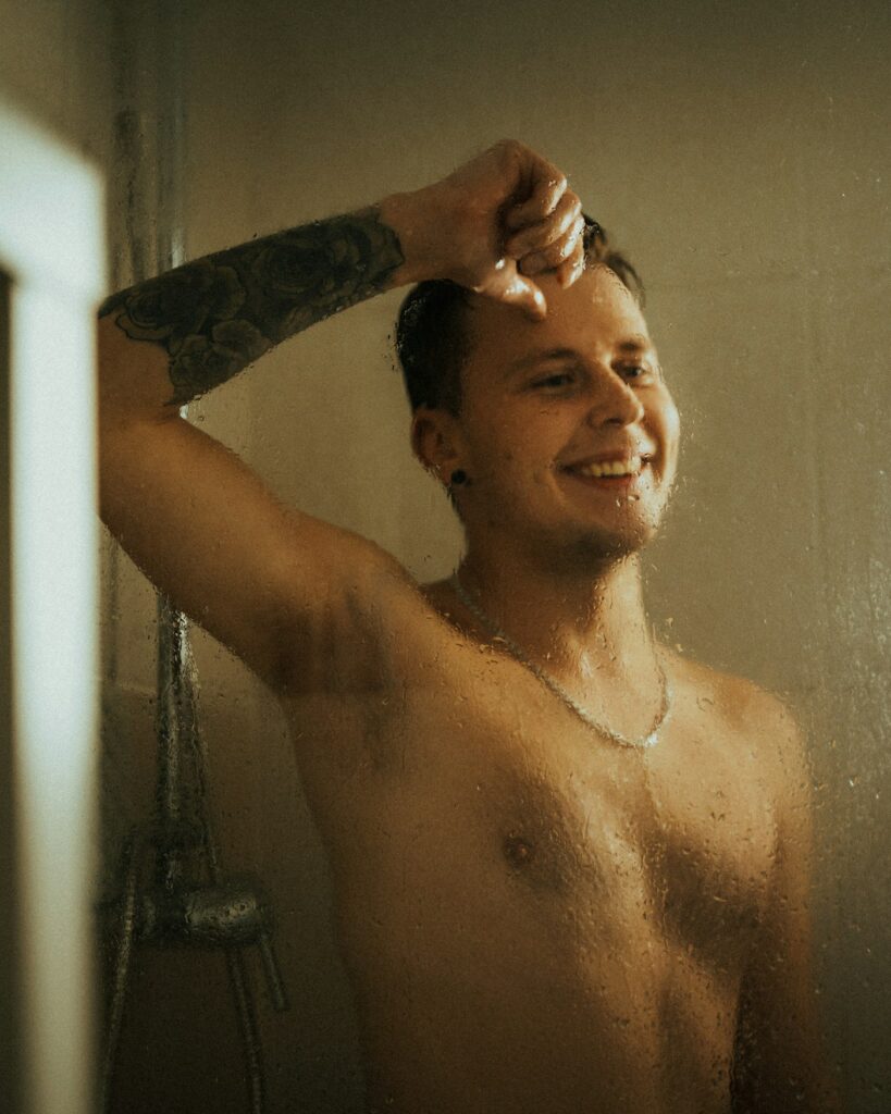 Half sleeve tattoos for men: upper arm half sleeve on a shirtless man