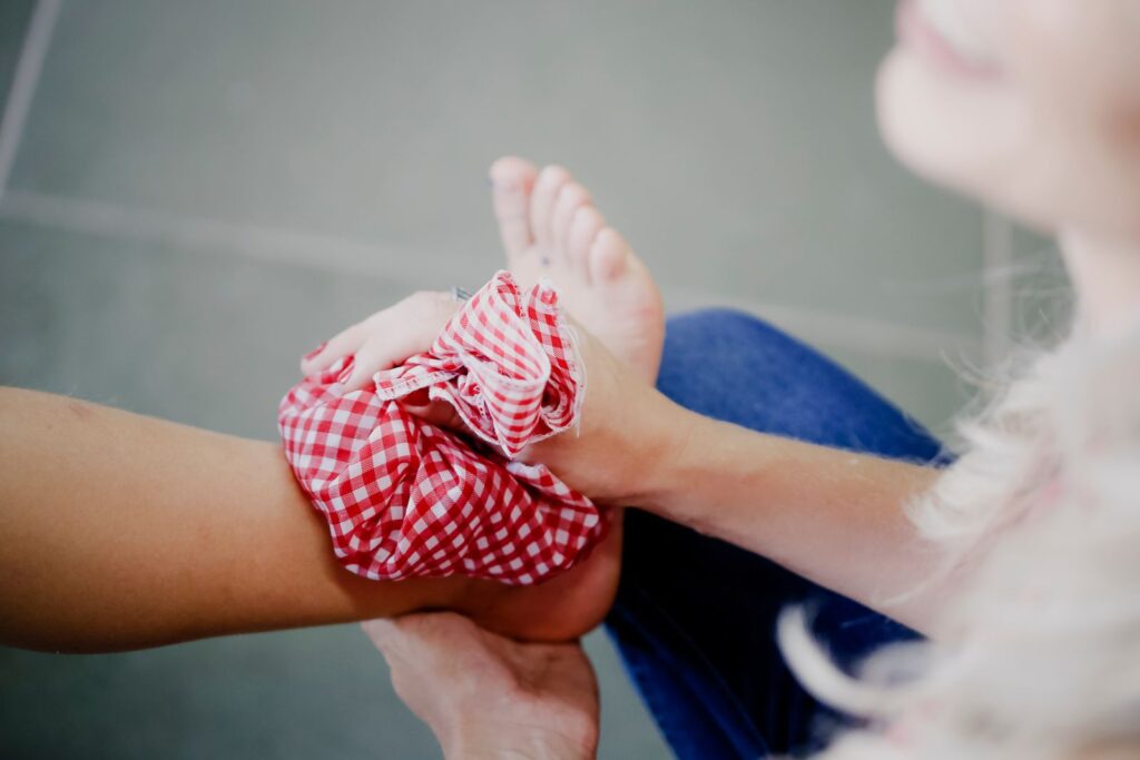 Cold pack wrapped in a cloth held against the skin