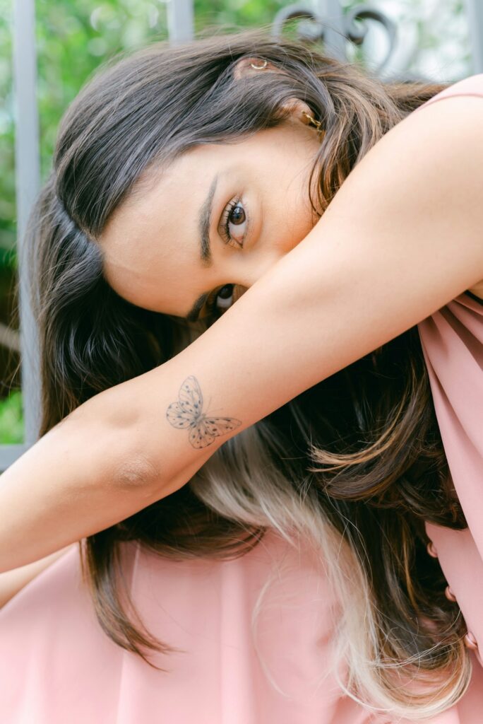 Small butterfly tattoo on the forearm